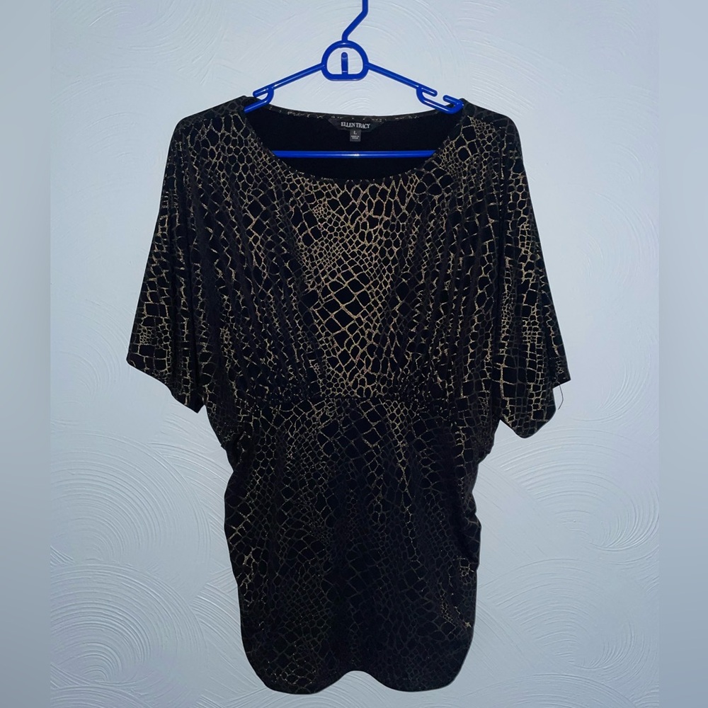 Woman’s black shirt with glittery gold